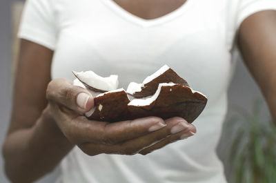 Close-up of woman holding ice cream