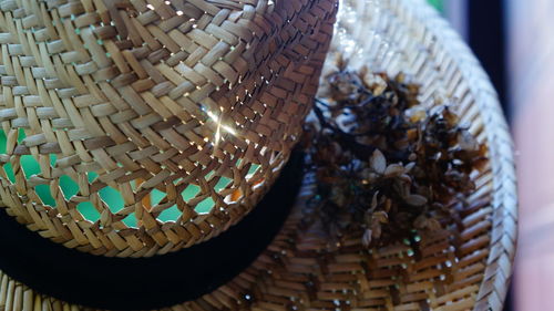 Close-up of wicker hat with dried flowers