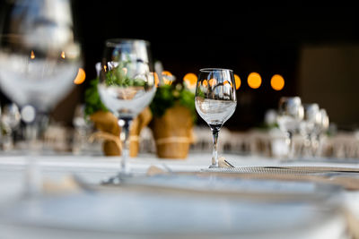 Luxury table settings for fine dining with and glassware, pouring wine to glass. 