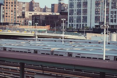 View of railroad tracks with cityscape in background