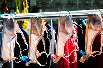 Clothes hanging in store for sale at market