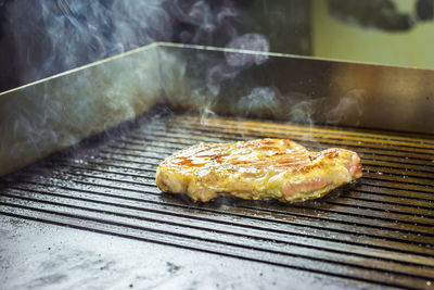 Close-up of meat on barbecue grill