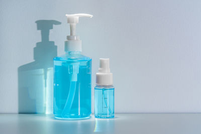 Close-up of blue bottles on table