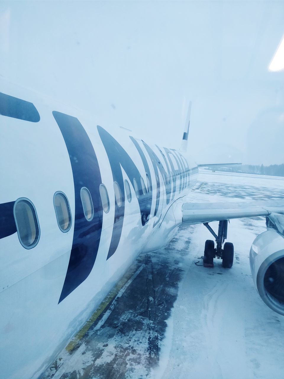 AIRPLANE WING IN SNOW