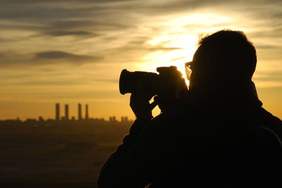 Silhouette of woman at sunset