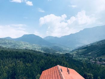 Scenic view of landscape and mountains against sky