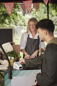 Clients buying food at food stall