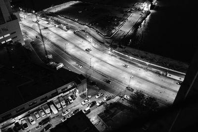 High angle view of city street and buildings at night