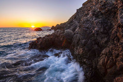 Scenic view of sea against sky during sunset