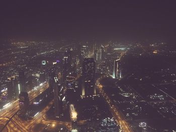 Aerial view of illuminated cityscape at night