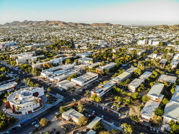 High angle view of city buildings against sky