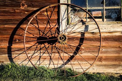 Old wheel outside house