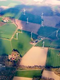 Aerial view of buildings and landscape against sky