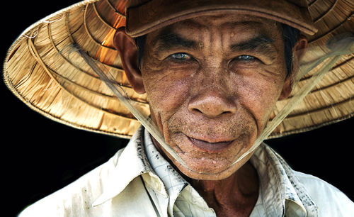 Close-up portrait of man wearing hat