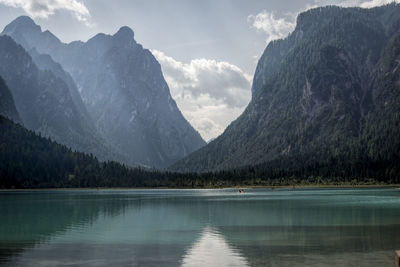 Scenic view of lake and mountains against sky