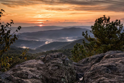 Scenic view of mountains against sky during sunset