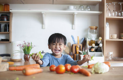 Portrait of boy in kitchen at home