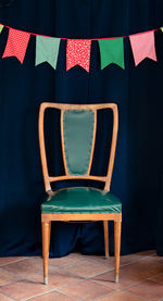 Chair by curtain