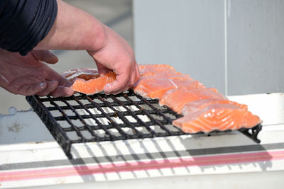 Close-up of hand holding sushi