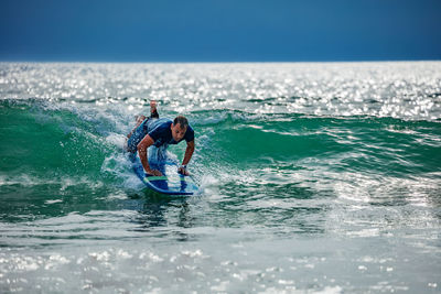 Man surfing in sea