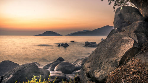 Scenic view of sea against sky during sunset