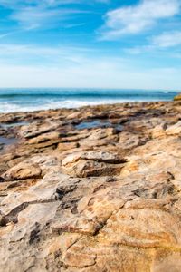 Scenic view of sea and rocks against sky