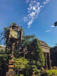 Low angle view of clock tower against sky