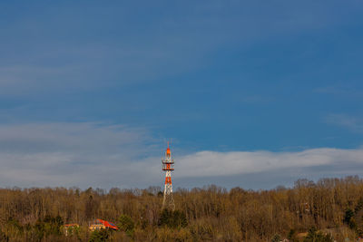 View of tower on field against sky