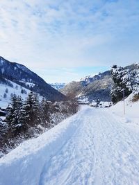 Scenic view of snowcapped mountains against sky