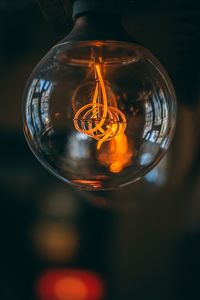 Close-up of illuminated light bulb