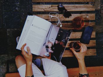 High angle view of woman reading book