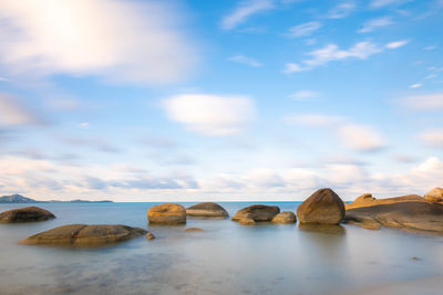 Long exposure shot of sea and the stones on the beach in koh samui.