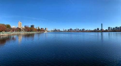 Buildings in city against blue sky in boston
