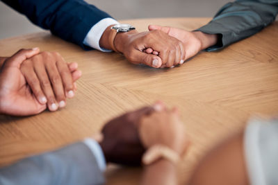 Cropped hands of man giving jigsaw puzzle