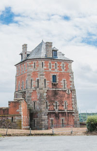 Low angle view of old building against sky