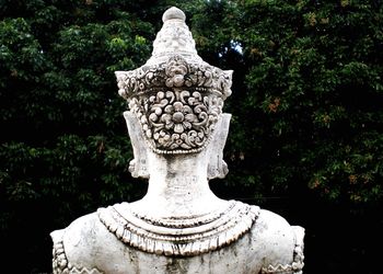 Close-up of statue against trees