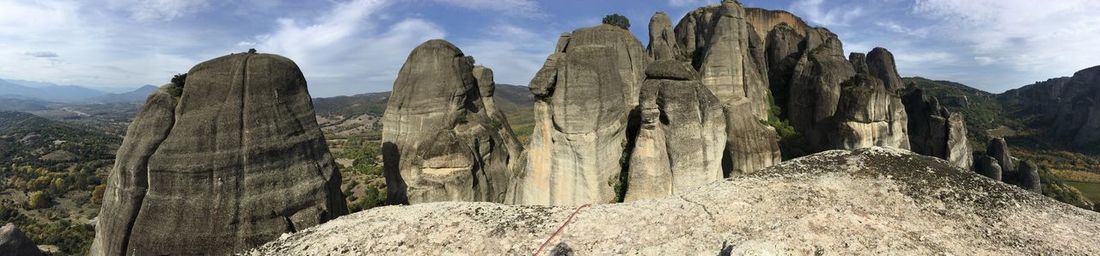 Panoramic view of rocky mountains against sky