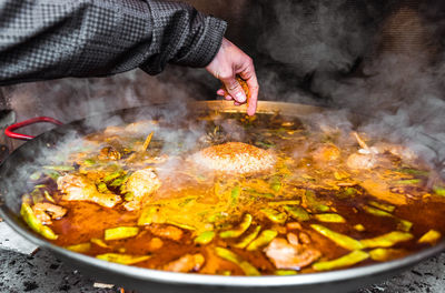 Close-up of hand preparing food in kitchen