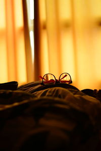 Eyeglasses on bed at home