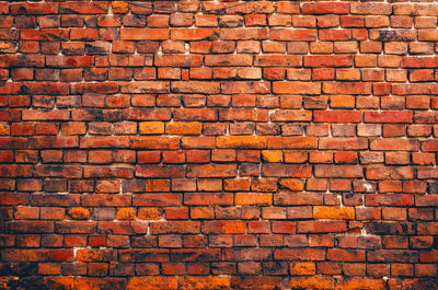 Vintage orange brick wall. brickwork with cracks. abstract background.