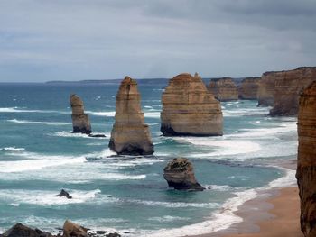 Scenic view of sea against cloudy sky