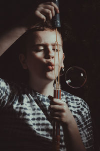 Portrait of boy drinking water