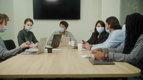 Group of people working on table