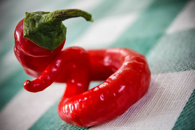 Close-up of red chili pepper on tablecloth