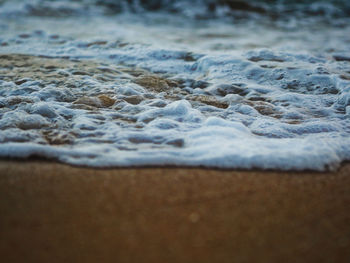 Close-up of waves on beach