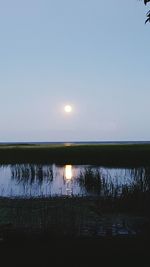 Scenic view of lake at sunset