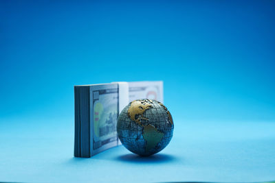 Close-up of glass against blue background