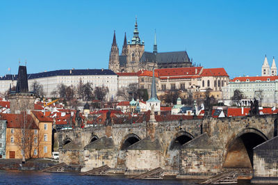 Arch bridge over river in city