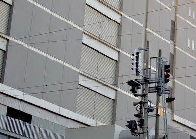 Low angle view of modern light against building