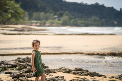 Portrait of girl standing on beach